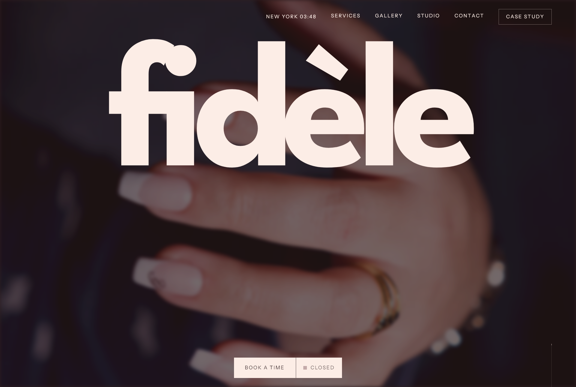 Fidèle nail studio website with a large cream wordmark over a dark photograph of manicured hands